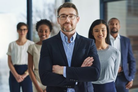 Team of smart and successful business people, leader or manager looking happy, satisfied or confident with their job, career and business. Face portrait of smart or ambitious corporate men and women.